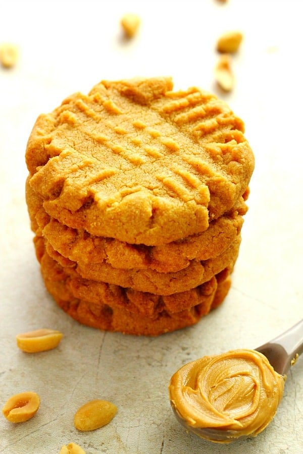 Side shot of peanut butter cookies in a stack.