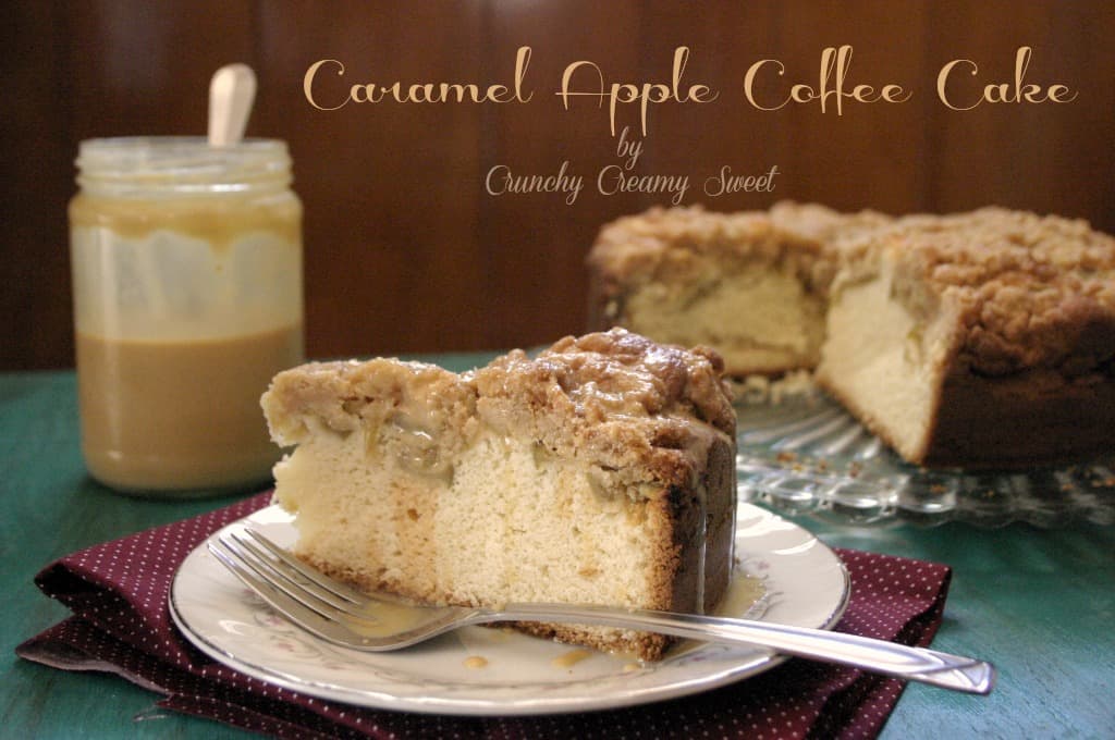 Side shot of a slice of caramel apple coffee cake on plate with fork.