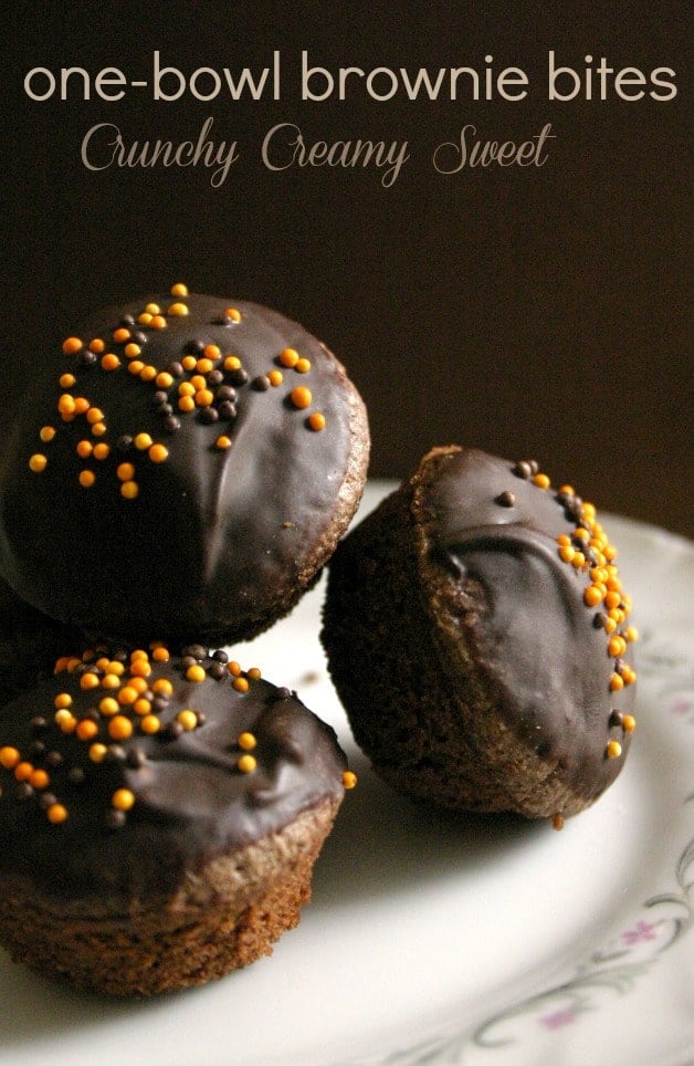 Side shot of brownie bites with glaze on plate.