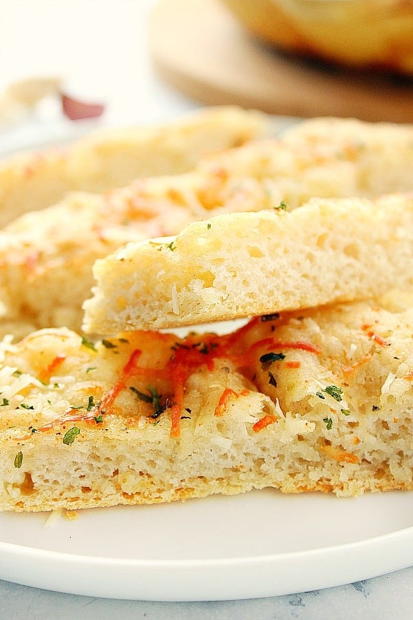 Slices of focaccia on white plate.