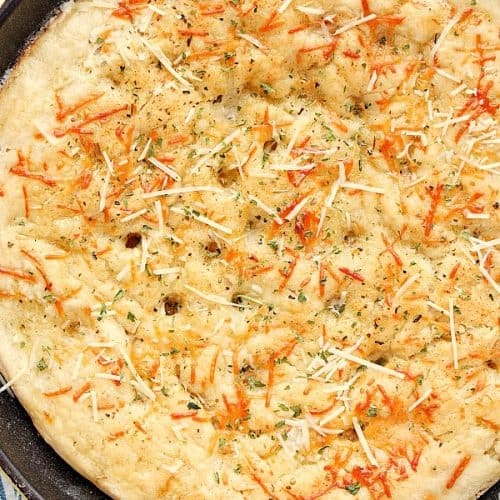 Skillet Focaccia with Parmesan cheese on top.