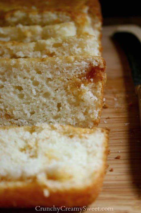 Close up shot on sliced quick bread on cutting board.