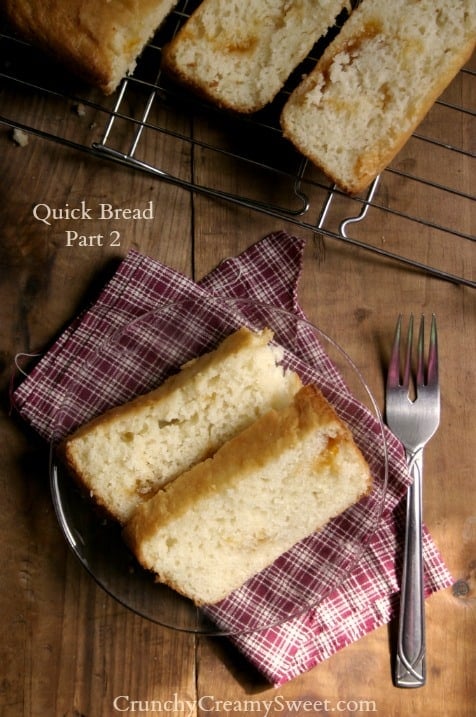 Overhead shot of two slices of quick bread on glass plate.