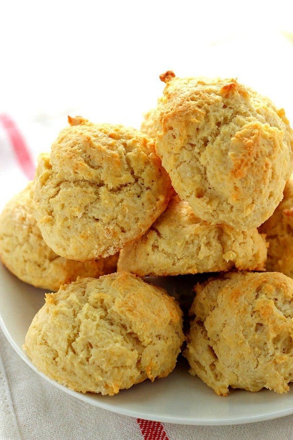Drop Biscuits - the easiest biscuits and super fluffy! Drop Biscuits stacked on plate.