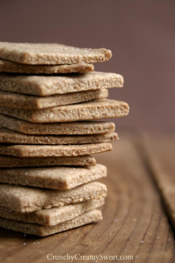 Close up shot of a tower of homemade wheat thins crackers.