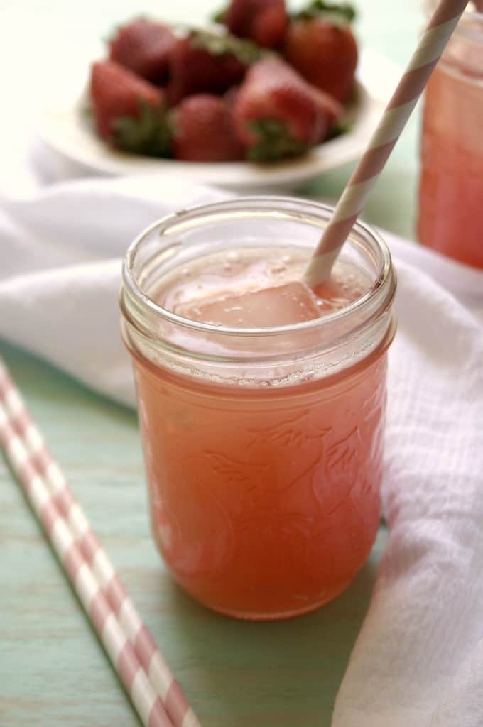 Side shot of glass jar with strawberry agua fresca.