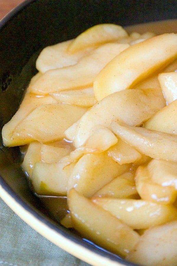 Caramel Apple slices in a skillet.