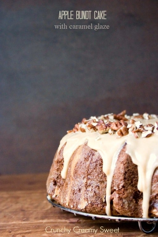 Apple Bundt Cake with Caramel Glaze - melt-in-your-mouth bundt cake with chunks of apples and sweet caramel glaze. Perfect Thanksgiving dessert idea! Apple Bundt Cake with Caramel Glaze and chopped pecans.