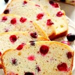 Cranberry Bread sliced on a white plate.