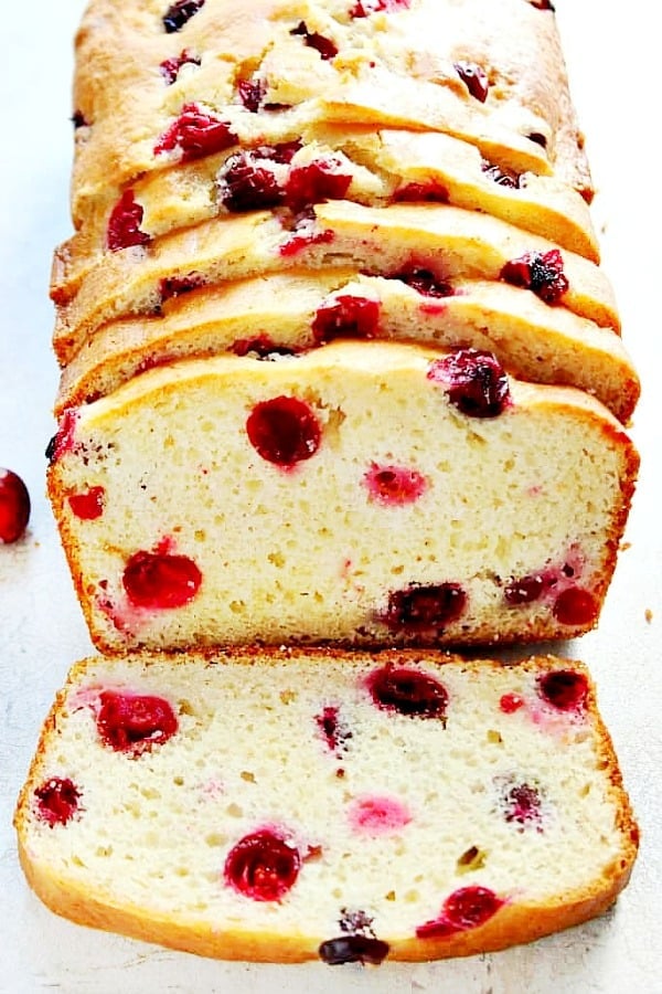 Cranberry Bread sliced on a marble board.