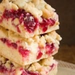 Festive crumb bars for holidays with cranberry jam and white chocolate.