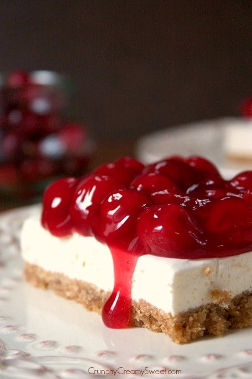 A family recipe for the holiday's favorite dessert: Cherry Delight! No-bake cheesecake filling on a cracker crust, all topped with cherry pie filling.