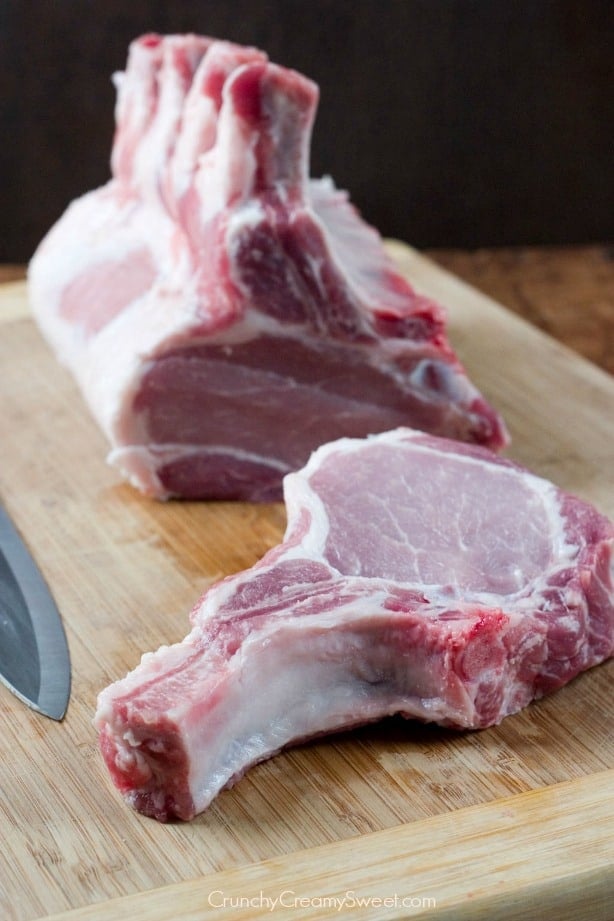 Side shot of bone-in pork loin sliced into chops.
