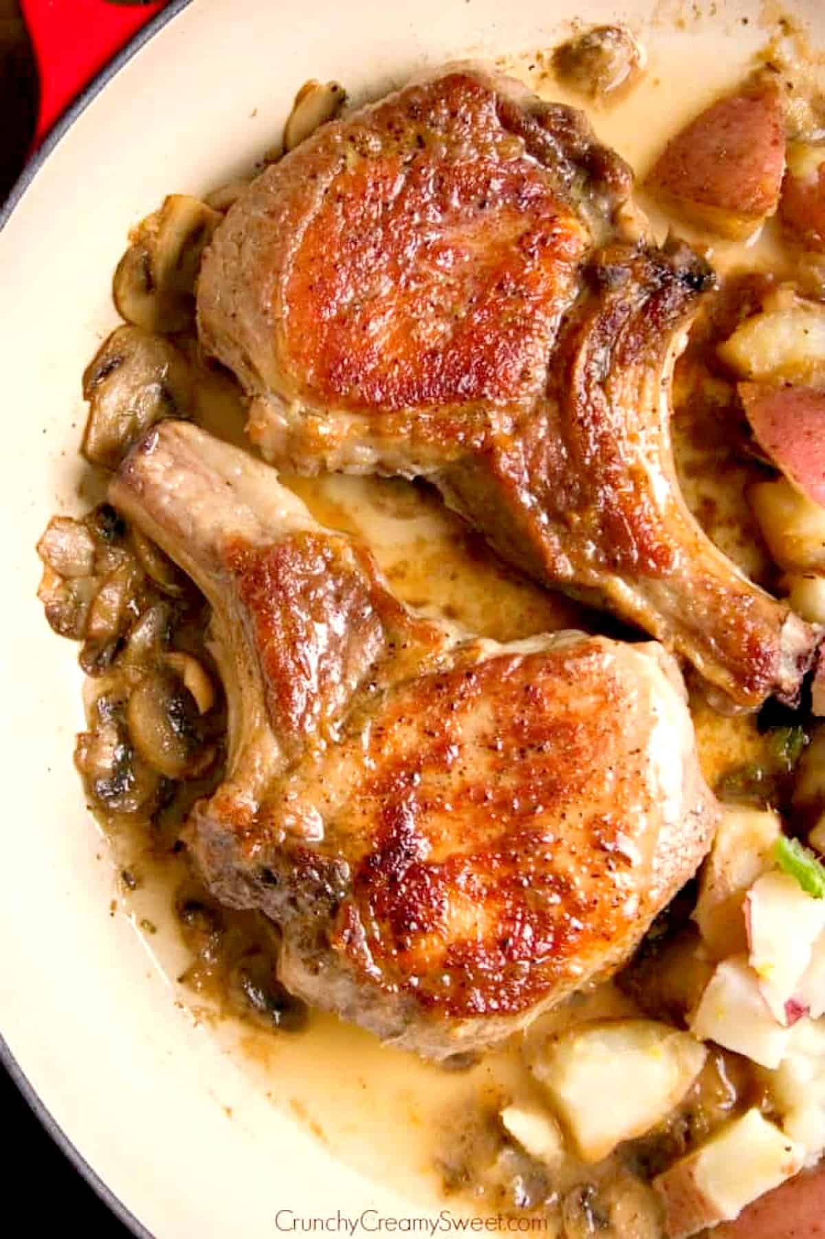 Pork chops in a pan.