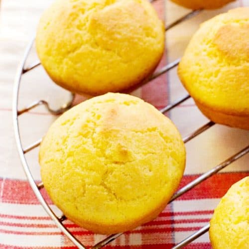 Perfect Cornbread Muffins set on cooling rack.