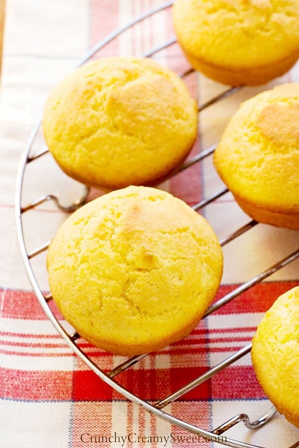 Perfect Cornbread Muffins set on cooling rack.