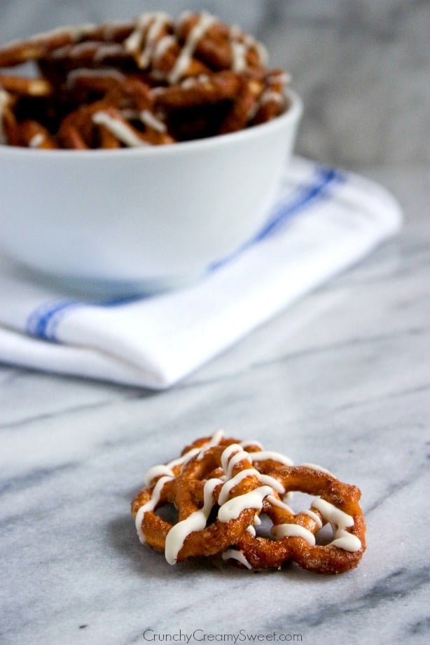 Cinnamon Roll Pretzels - cinnamon sugar coated pretzels baked and drizzled with white chocolate. Comes together in under 20 minutes!