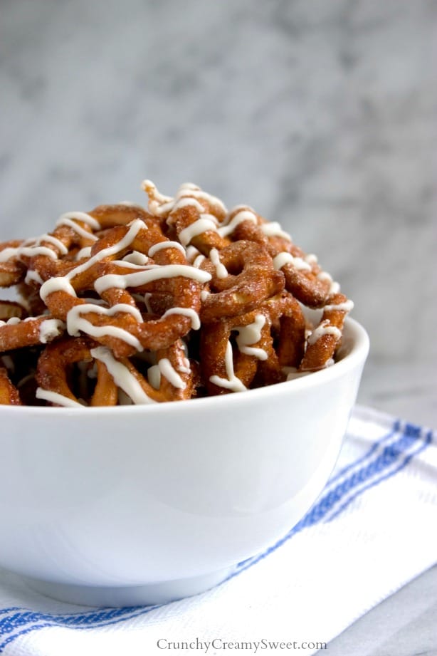 Cinnamon Roll Pretzels - cinnamon sugar coated pretzels baked and drizzled with white chocolate. Comes together in under 20 minutes!