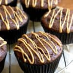 Double Chocolate Muffins with Peanut Butter Glaze on a rack.