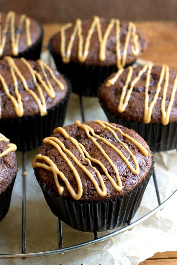 Double Chocolate Muffins with Peanut Butter Glaze on a rack.