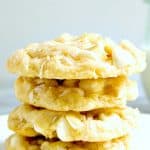 White Chocolate Coconut cookies stacked on plate.