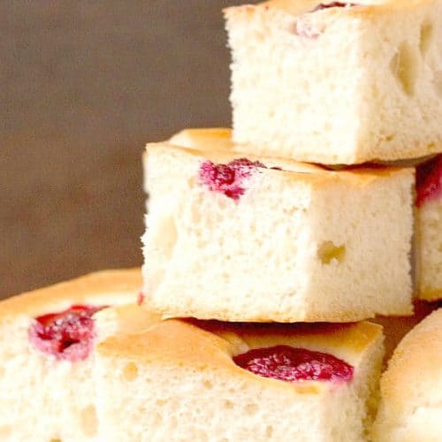 Raspberry Focaccia pieces on a plate.