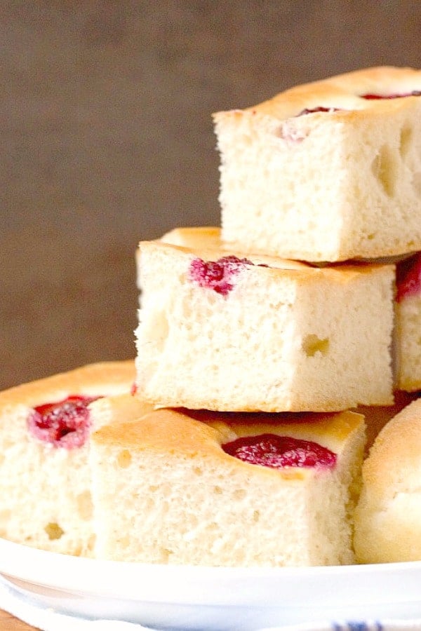 Raspberry Focaccia pieces on a plate.