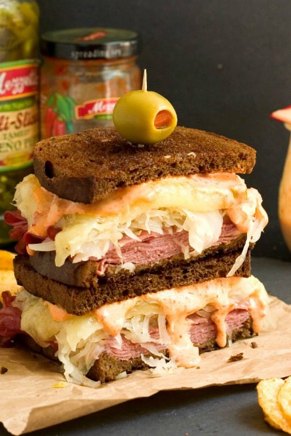 Spicy Reuben Sandwich sliced in half and stacked.