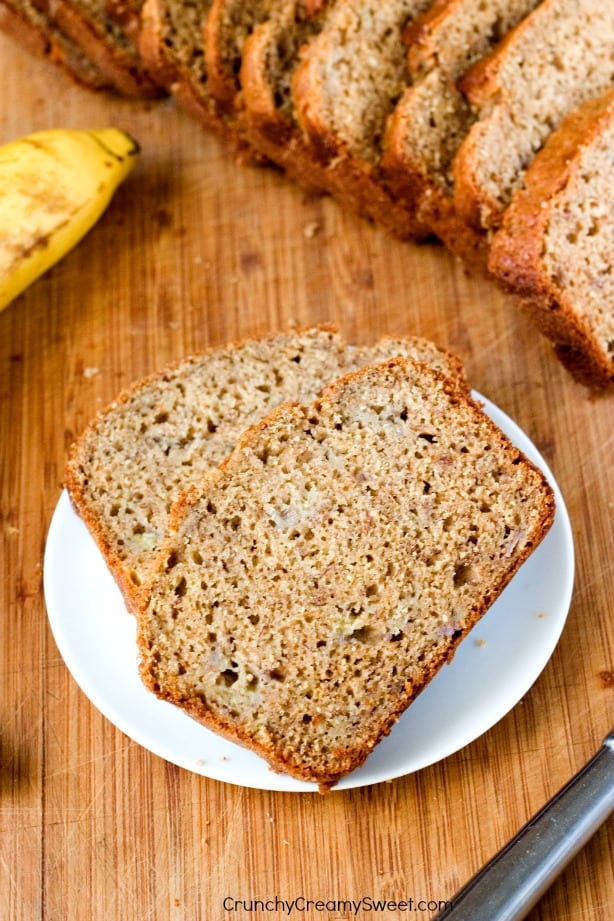 Whole Wheat Yogurt Banana Bread with Cinnamon - healthier version of your favorite quick bread! This banana bread is so good, it will be devoured quickly! Great way to use those overripe bananas!
