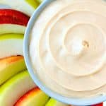Caramel Apple Dip in a bowl surrounded by apple slices.