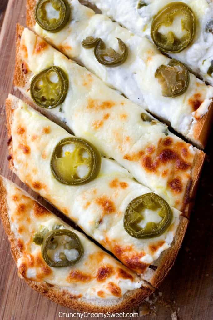 Jalapeno Popper Cheesy Garlic Bread - spicy take on our favorite cheesy garlic bread! You will love it! It's the perfect game day food!