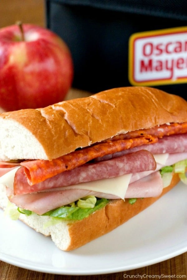 Italian Pepperoni Sandwich - great lunchbox sandwich idea! Loaded with deli sliced meat and cheese as well as shredded lettuce. Perfect to add to your lunch menu. Italian Pepperoni Sandwich on a plate.