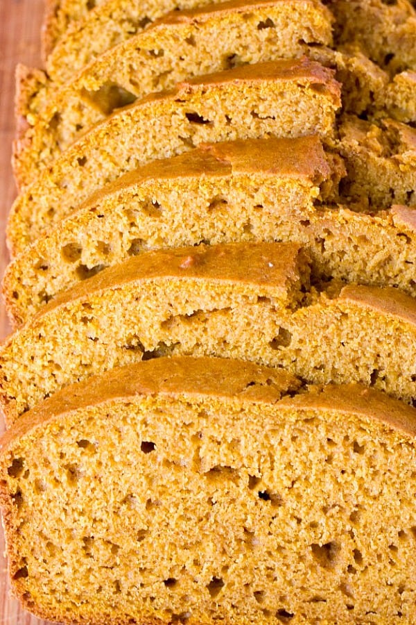 Pumpkin Bread with Cinnamon Cream Cheese Spread - enjoy a soft and delicious pumpkin bread with a cinnamon cream cheese spread on chilly fall days. Pumpkin Bread sliced.