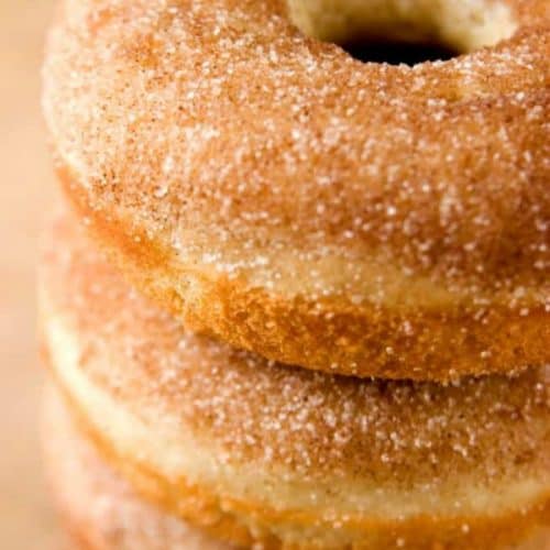 Cinnamon Sugar Donuts stacked on a plate.