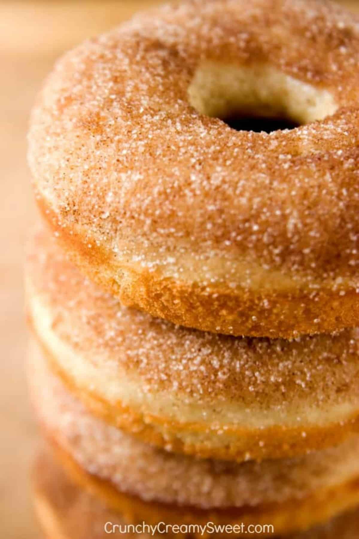 Cinnamon Sugar Donuts stacked on a plate.