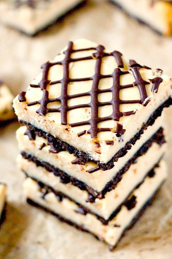 Peanut Butter Cheesecake Bars stacked up.