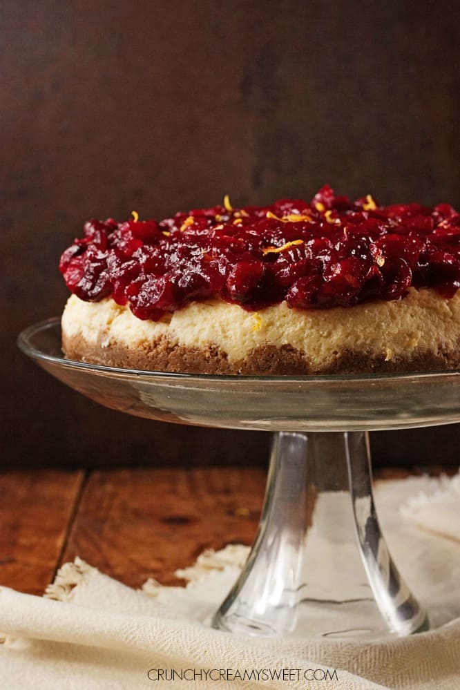 Cranberry Orange Cheesecake - sweet and creamy orange cheesecake baked to perfection, topped with gorgeous cranberry sauce. This cheesecake is perfect finish to your Christmas dinner!