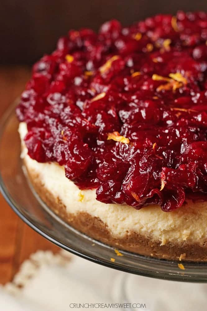 Cranberry Orange Cheesecake - sweet and creamy orange cheesecake baked to perfection, topped with gorgeous cranberry sauce. This cheesecake is perfect finish to your Christmas dinner!