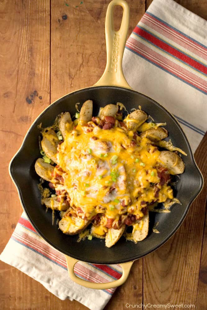 Lightened Up Chili Cheese Fries - this reinvented version of chili fries is incredibly easy to make and better for you than the original! Also, check out our lighter versions of dinner classics that everyone will love!