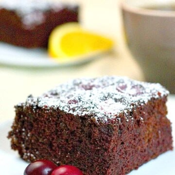 Orange Cranberry Chocolate Cake Slice on plate.