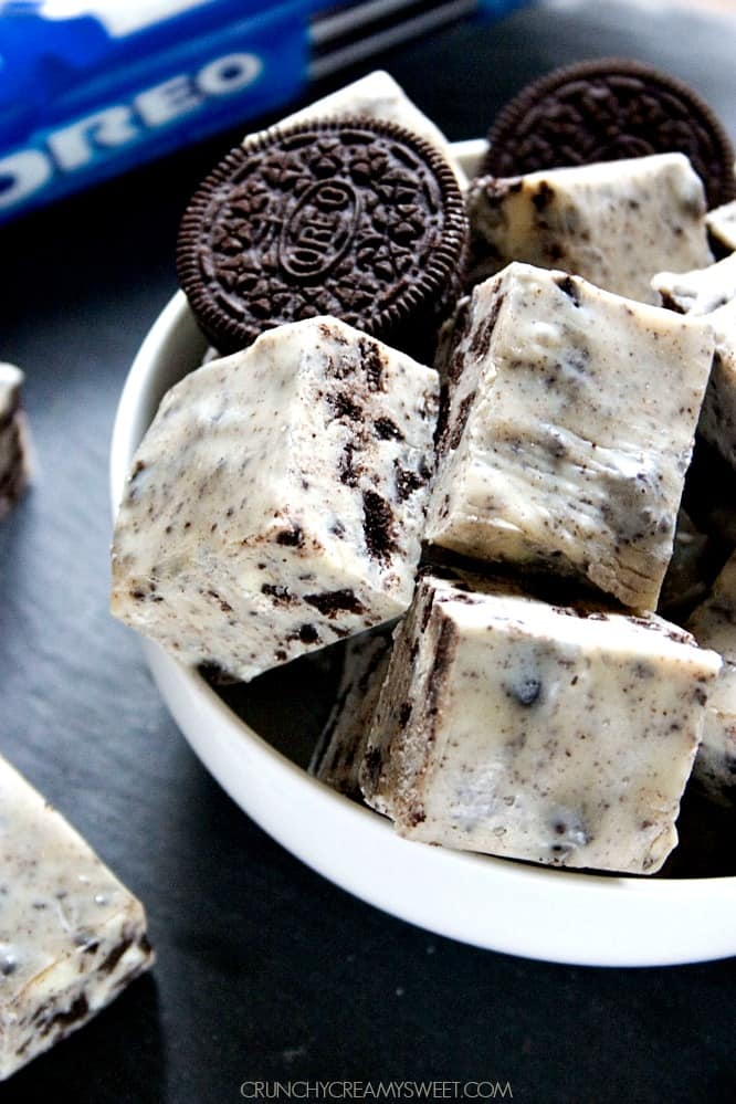 Side shot of Oreo fudge squares in a bowl.