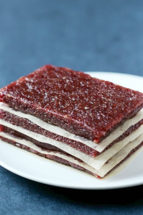 Cranberry Walnut Energy Bars stacked on plate.