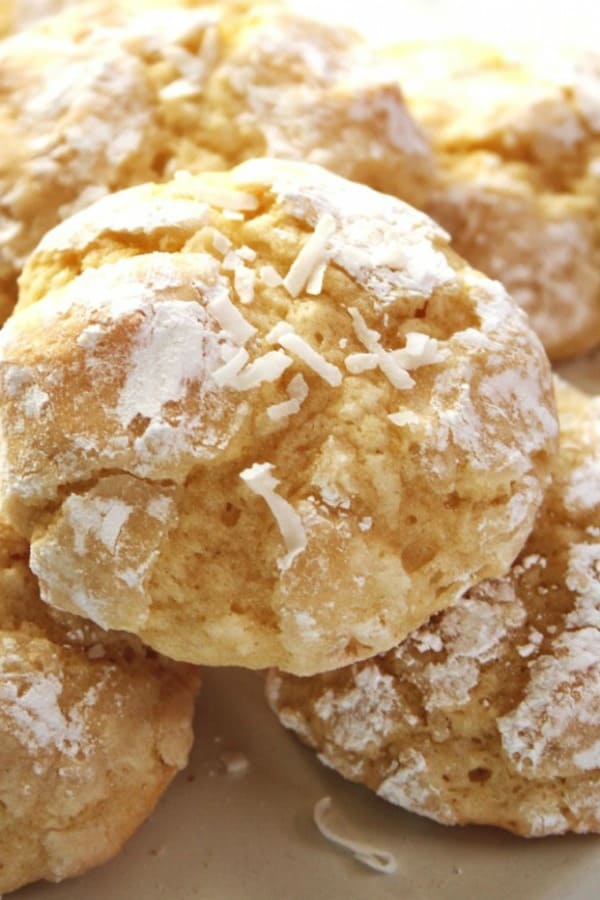 Coconut Crinkle Cookies - easy one-bowl cookies with lots of coconut flavor thanks to the extract and shredded coconut! Coconut Crinkle Cookies on a plate.