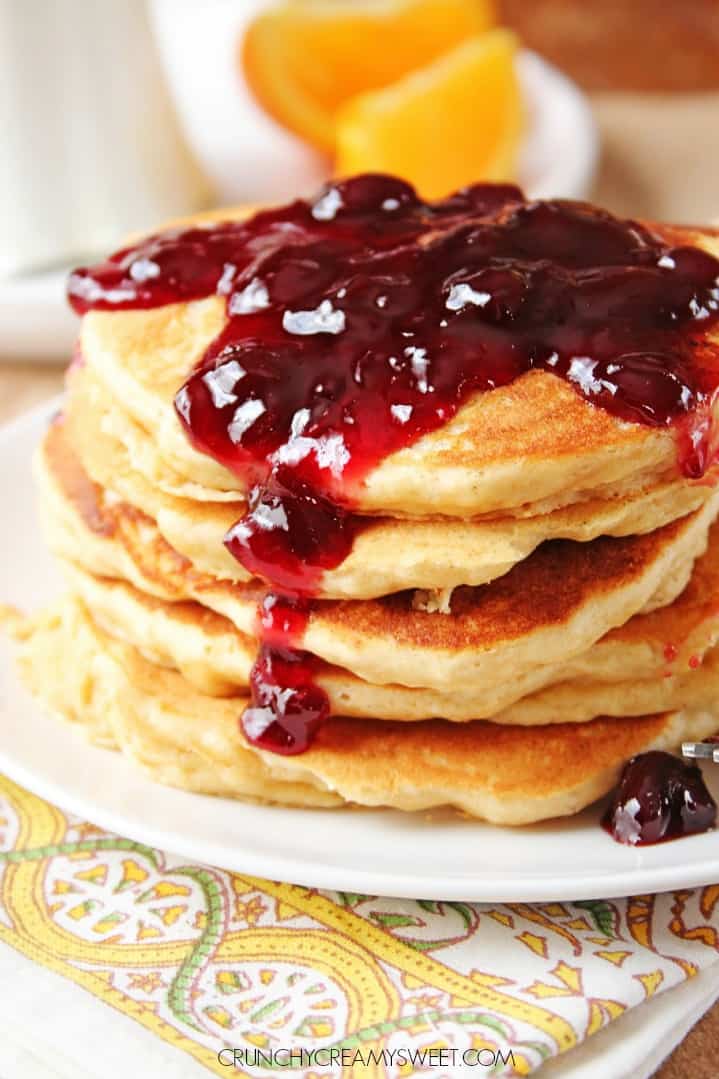 Peanut Butter Jelly Pancakes on white plate and napkin.