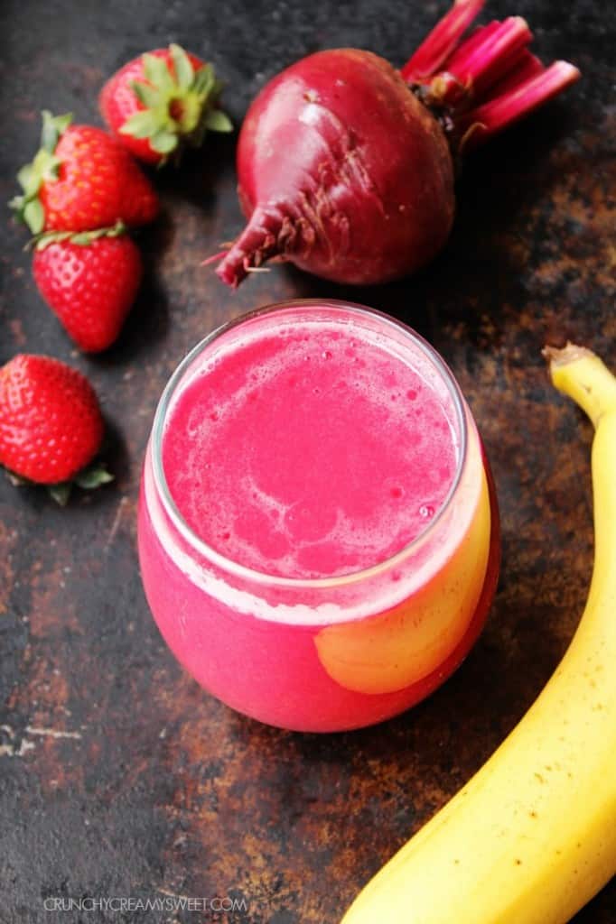 Beets and Berries Smoothie - a power-drink that's packed with Vitamins, anti-oxidants and gives your skin a healthy glow. #recipe #healthy #smoothie crunchycreamysweet.com Beet Smoothie in a glass.