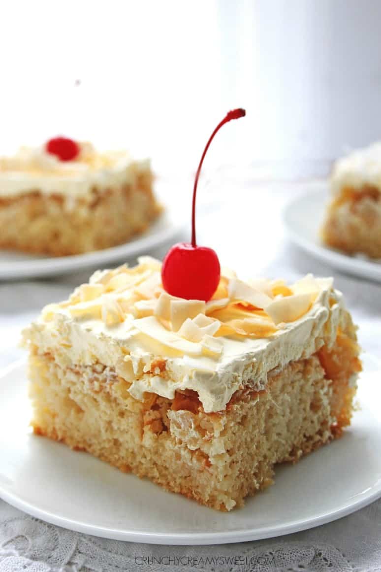 Pina Colada Cake - sweet and delicious cake with coconut, pineapple and rum! Crazy good! crunchycreamysweet.com