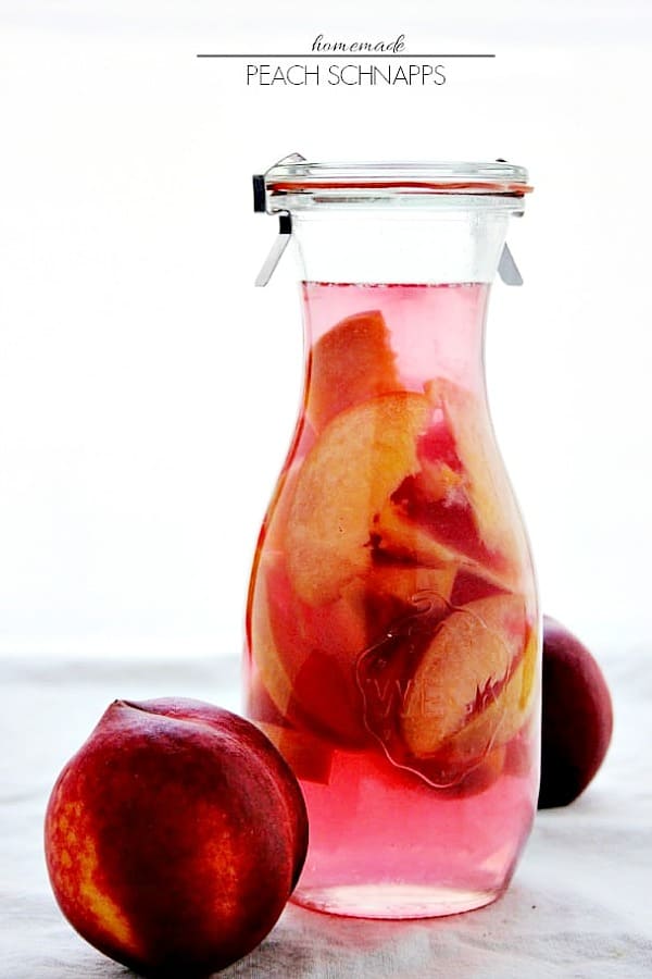 Homemade Peach Schnapps - a fruity liqueur for your summer cocktails! You won't believe how easy it is to make! Peach Schnapps in a glass bottle.