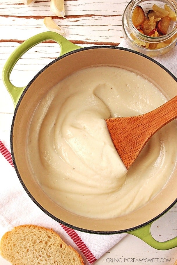 Roasted Garlic Cauliflower Alfredo Sauce - a 4-ingredient healthy, creamy sauce that's great for pasta, pizza or dipping! @crunchycreamysw Overhead shot of cauliflower Alfredo sauce in saucepan.