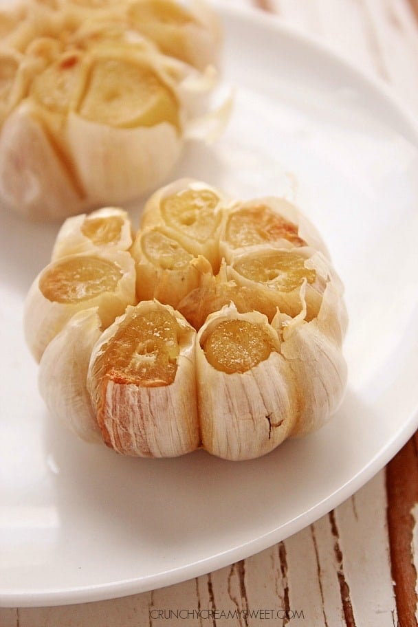 Roasted garlic on a plate.