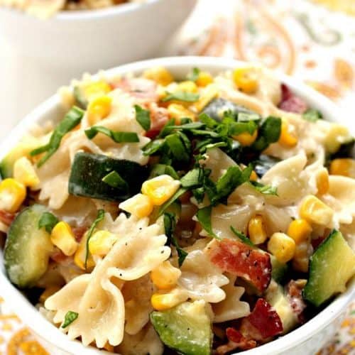 Corn and Zucchini Pasta in a white bowl.